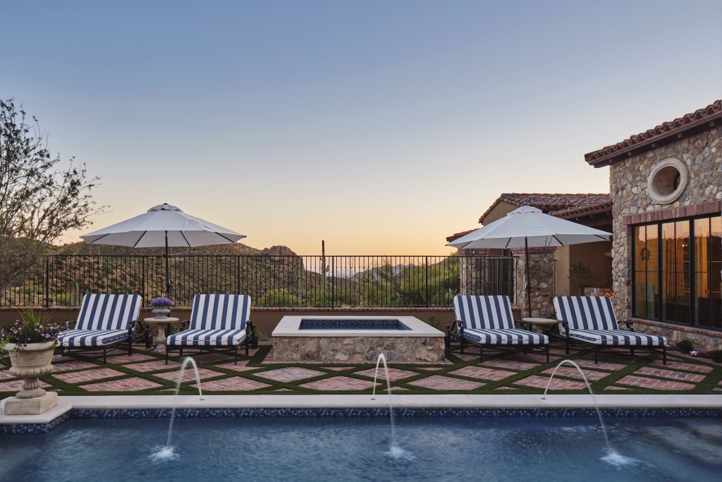 Cintarosa Manor pool terrace overlooking desert hills at sunset