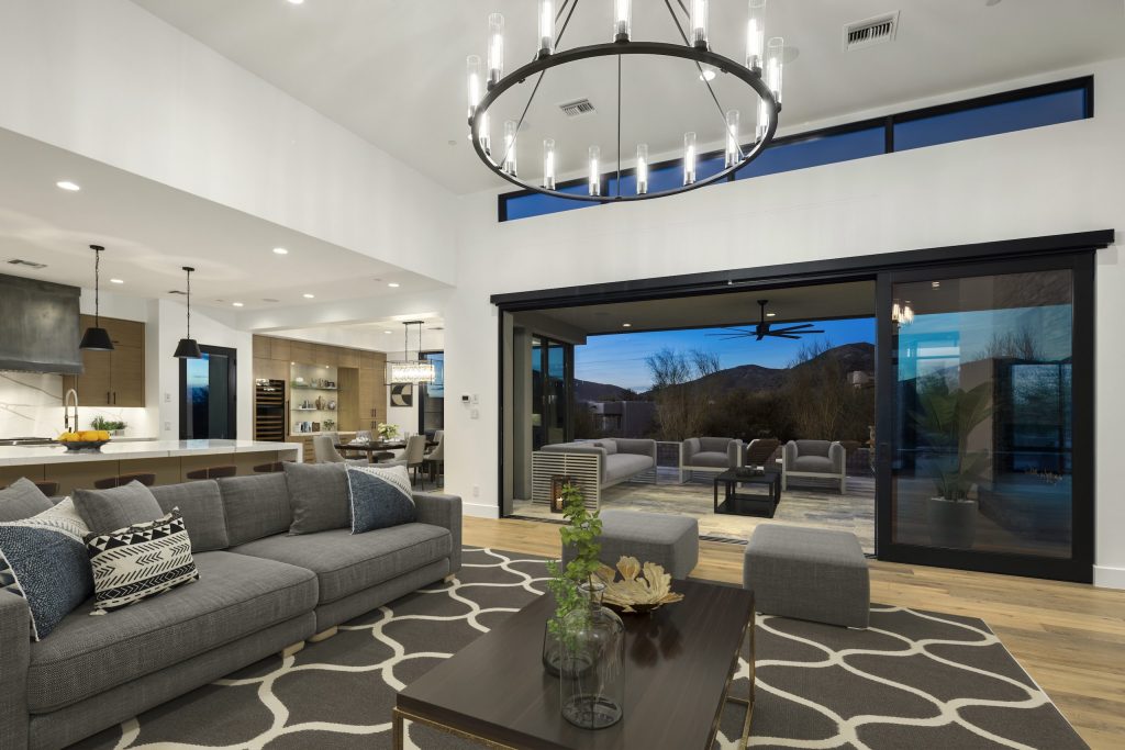 Arrowhead Modern living room opening to a terrace with mountain views