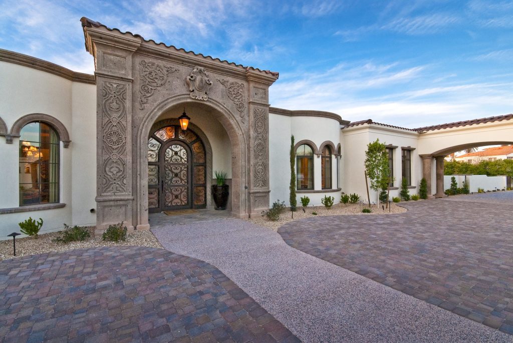 Carved stone entry and motor court at Mockingbird Estate by Calvis Wyant